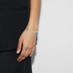 Gucci Interlocking Silver Chain Bracelet on female wrist